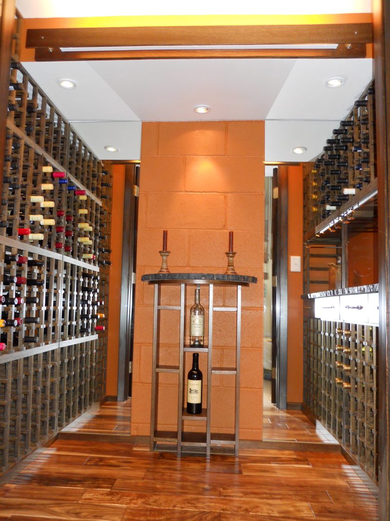 Straight view into a wine room with wood racks on both walls