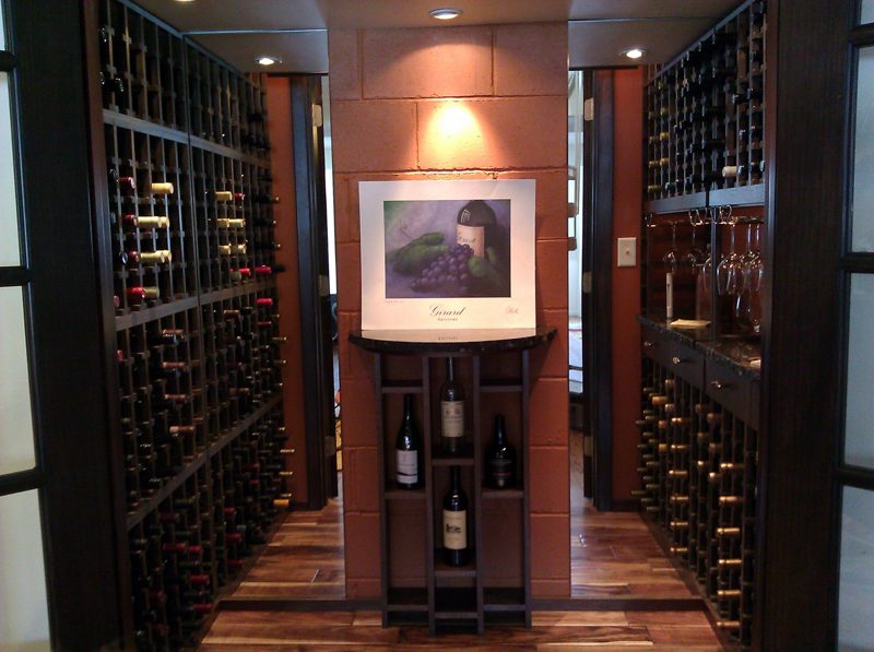Wine cellar with dark wood racks and a lighted center niche