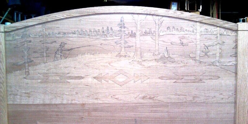 Unfinished light wood headboard carved with a wilderness scene and arrow motifs
