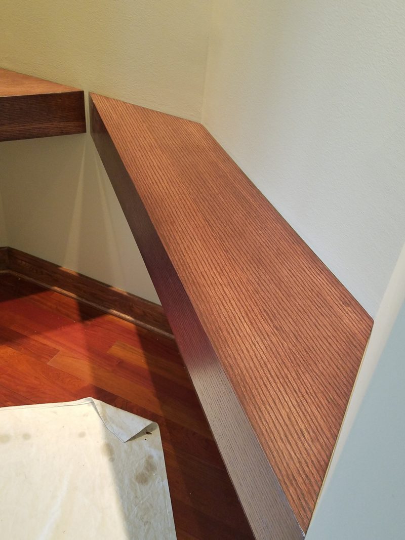 Close view of a floating wood bench with a fine ribbed grain surface
