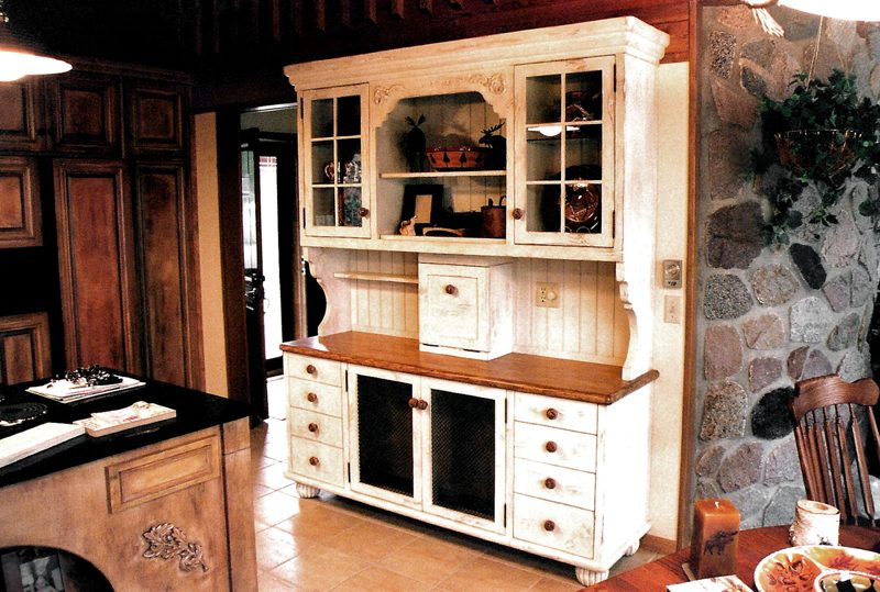 White display hutch with glass-front upper cabinets, open shelves, and a wood countertop