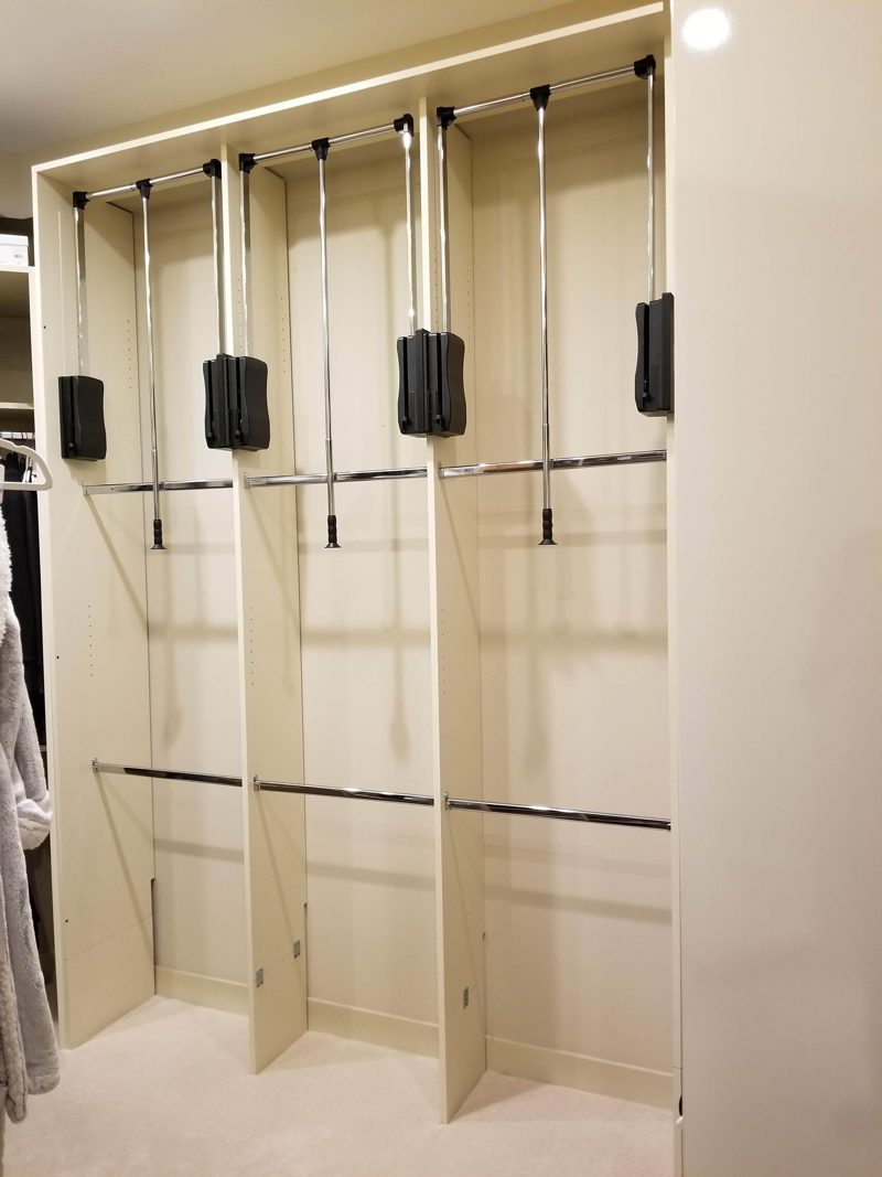 Light cabinet closet with pull-down hanging rods