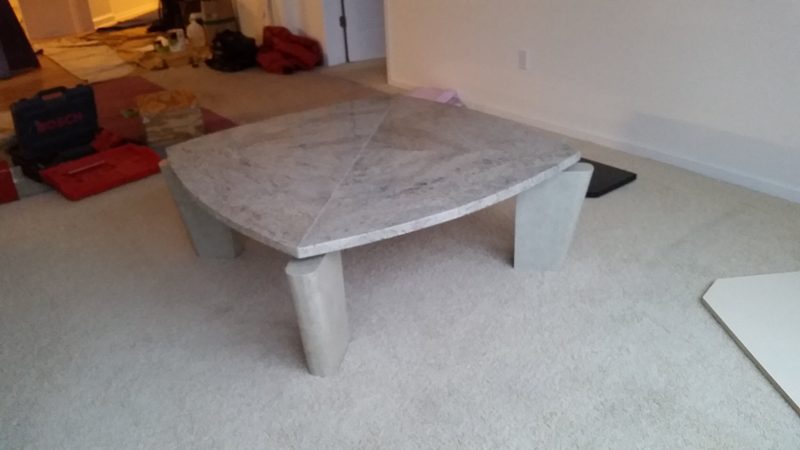 Light gray stone-look coffee table with angled legs