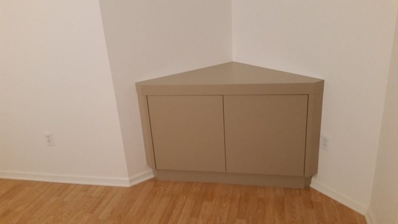 Taupe corner cabinet with two flat-panel doors