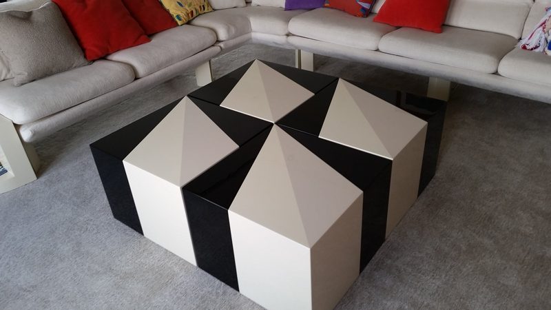 Black and cream ottoman with a geometric pyramid pattern